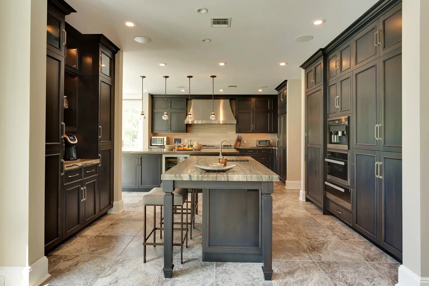Kitchen with dark-stained cabinetry and a center island
